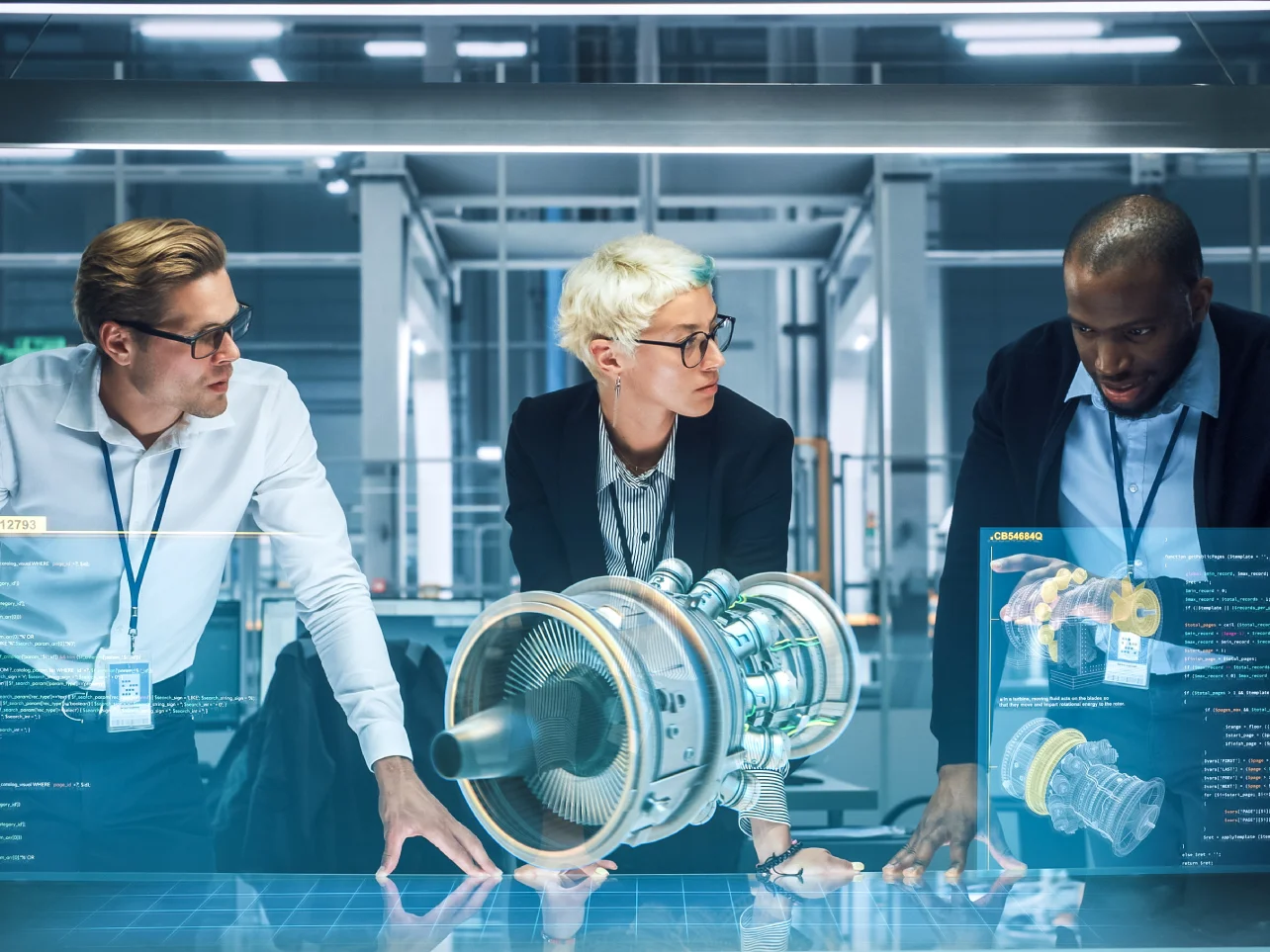 R&D and innovation engineers reviewing a physical prototype and digital simulation in a modern laboratory